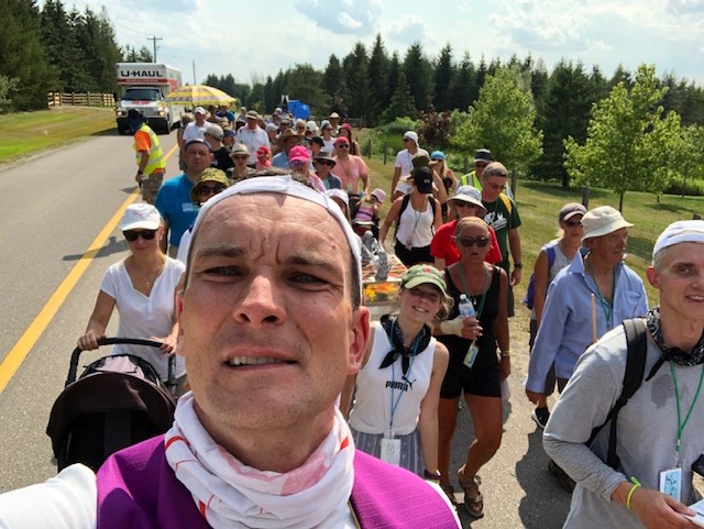 Fr. Adam with pilgrims